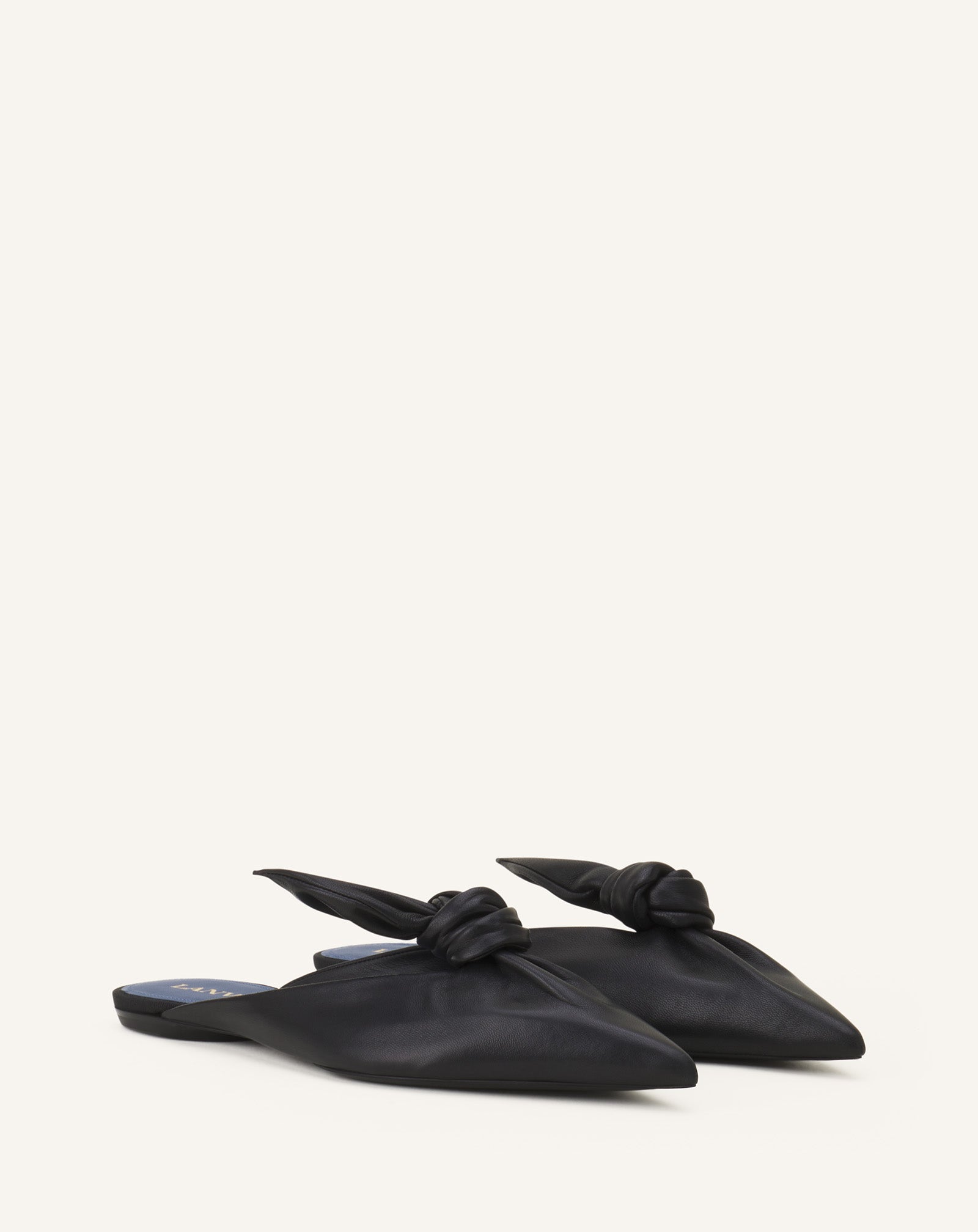 BLACK MIDNIGHT STEP MULES WITH A LEATHER BOW