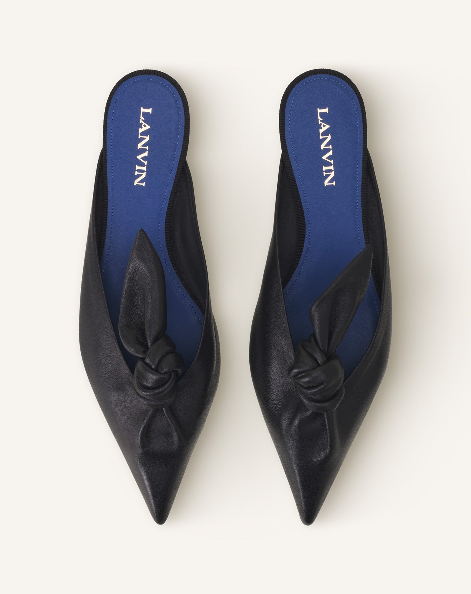 BLACK MIDNIGHT STEP MULES WITH A LEATHER BOW